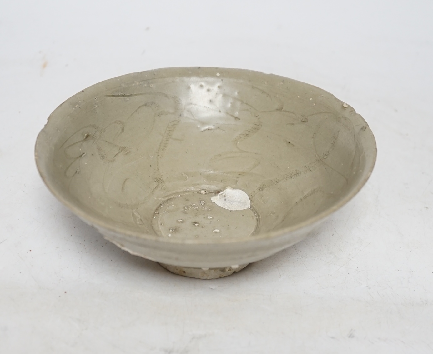 A Chinese carved shipwreck bowl, Song dynasty, 17cm diameter